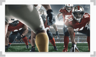 image of football players showing a quarterback preparing to hand off the football