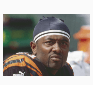 Akili Smith on sideline staring off
