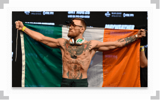 Conor McGregor holding Irish flag behind his back