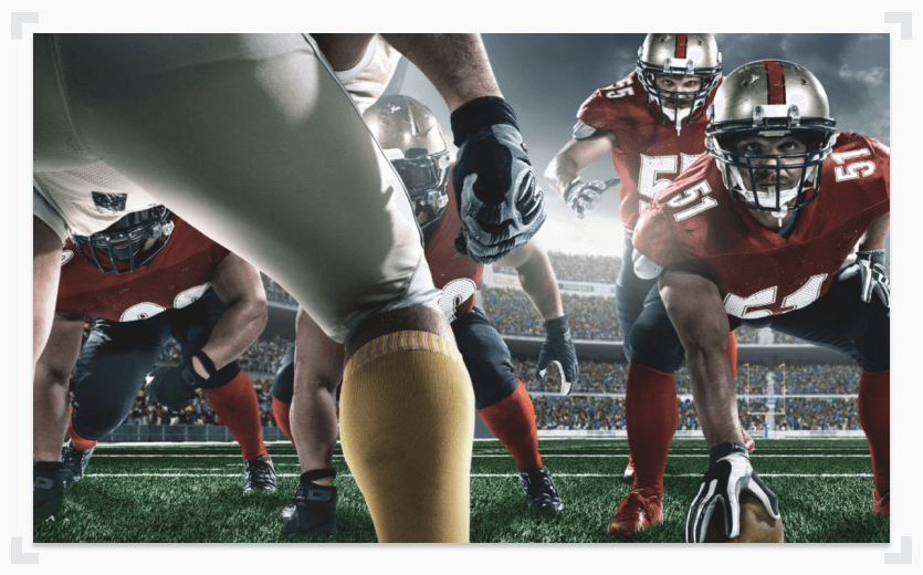 College football players head to head on line of scrimmage 