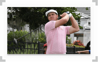 Bryson DeChambeau watching golf ball after swinging