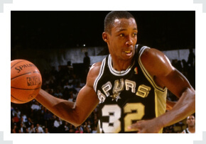 Sean Elliot San Antonio Spurs holding basketball one hand