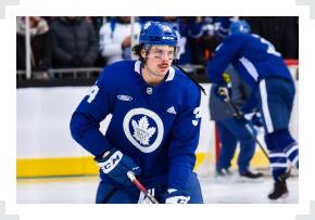 Auston Matthews skating two hands on stick Winter Classic jersey