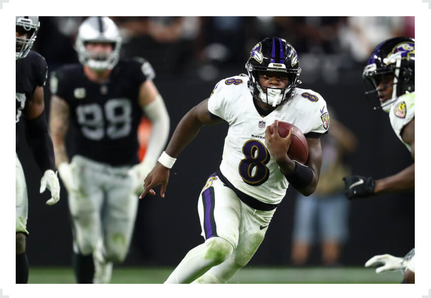 Lamar Jackson running with football