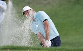 Scottie Scheffler hitting a bunker shot