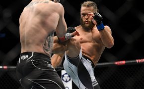 Rafael Fiziev throws a kick at Justin Gaethje