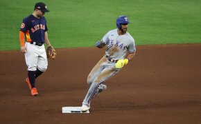Texas Rangers center fielder Leody Taveras arrives at second base