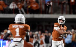 Texas' quarterback Quinn Ewers throws the ball to Texas' wide receiver Xavier Worthy