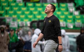 Dan Lanning sticks his tongue out to catch the rain