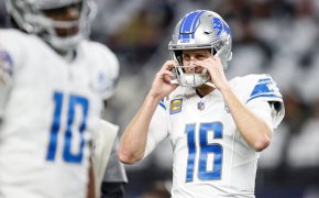 Detroit Lions QB Jared Goff grabbing helmet face mask white jersey
