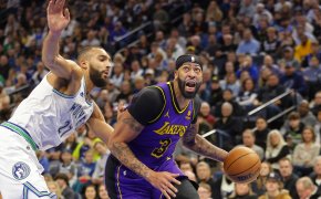Los Angeles Lakers forward Anthony Davis dribbles around Minnesota Timberwolves center Rudy Gobert