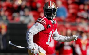 San Francisco 49ers player Deebo Samuel red jersey gold helmet