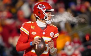 Patrick Mahomes preparing to throw football red jersey