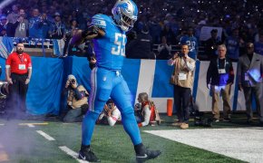 Detroit Lions player Derrick Barnes walking out intro blue jersey