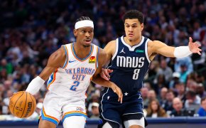 Oklahoma City Thunder guard Shai Gilgeous-Alexander dribbles as Dallas Mavericks guard Josh Green