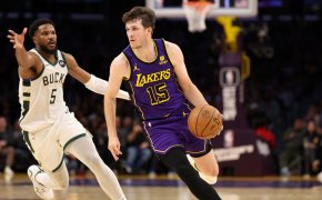 Los Angeles Lakers guard Austin Reaves drives to the basket against Milwaukee Bucks guard Malik Beasley