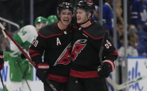 Carolina Hurricanes forward Sebastian Aho congratulates forward Jake Guentzel