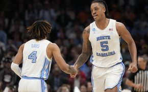 North Carolina Tar Heels forward Armando Bacot low-fives guard RJ Davis