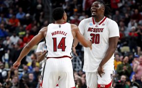 North Carolina State Wolfpack guard Casey Morsell celebrates with forward DJ Burns