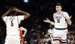 Connecticut Huskies center Donovan Clingan shrugs after scoring a basket